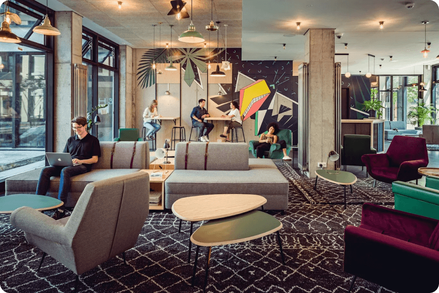 Students socializing in a Neon Wood community lounge